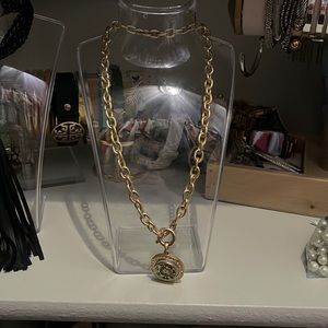 Front fasten necklace with gunshell charm
